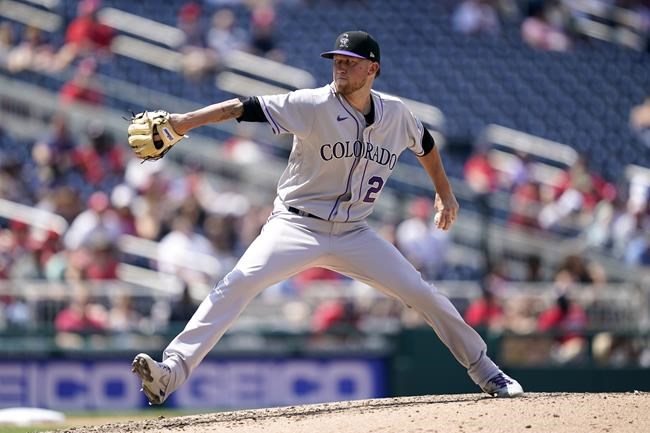 Colorado Rockies starting pitcher Kyle Freeland throws to the Washington Nationals in the fourth inning of a baseball game, Sunday, May 29, 2022, in Washington. (AP Photo/Patrick Semansky)