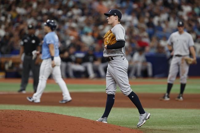 New York Yankees pitcher Ron Marinaccio stands at the mound after walking in a run during the seventh inning of a baseball game against the Tampa Bay Rays, Sunday, May 29, 2022, in St. Petersburg, Fla. (AP Photo/Scott Audette)