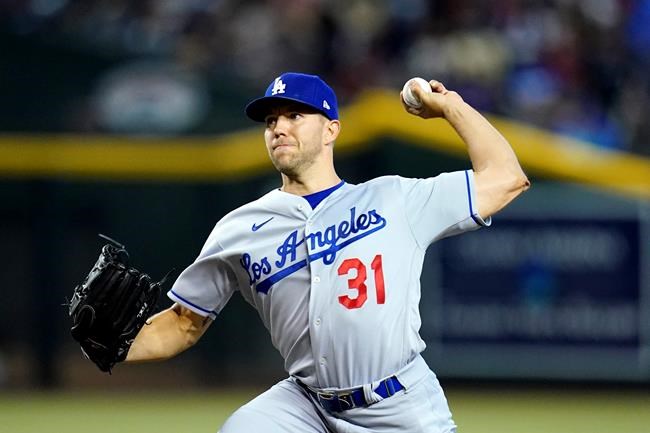Los Angeles Dodgers starting pitcher Tyler Anderson throws a pitch against the Arizona Diamondbacks during the first inning of a baseball game Sunday, May 29, 2022, in Phoenix. (AP Photo/Ross D. Franklin)