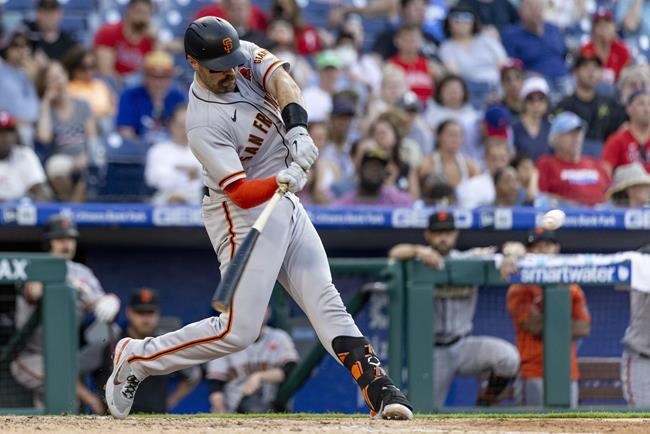 San Francisco Giants' Curt Casali hits a two-run home run during the 10th inning of a baseball game against the Philadelphia Phillies, Monday, May 30, 2022, in Philadelphia. (AP Photo/Laurence Kesterson)