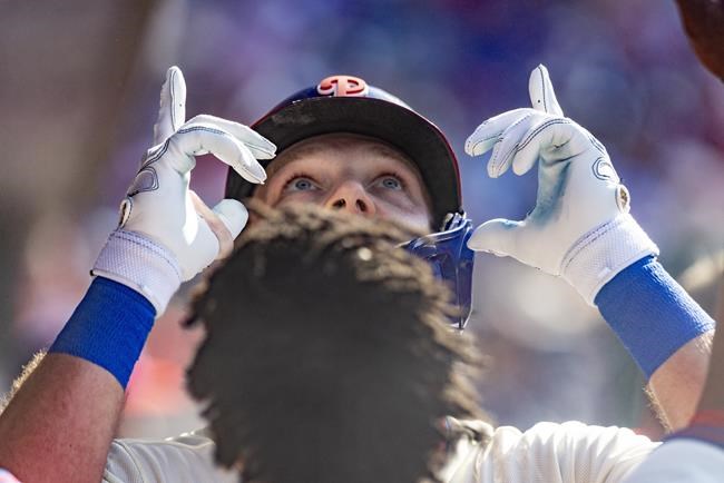Philadelphia Phillies' Rhys Hoskins celebrates in the dugout after hitting a home run during the fourth inning of a baseball game against the San Francisco Giants, Monday, May 30, 2022, in Philadelphia. (AP Photo/Laurence Kesterson)