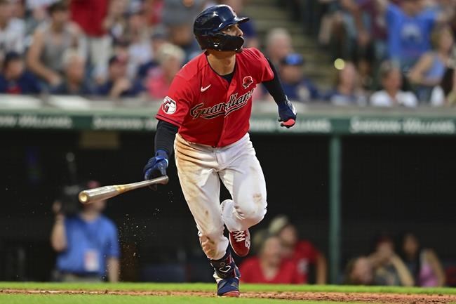 Cleveland Guardians' Andres Gimenez watches his three-run home run off Kansas City Royals relief pitcher Collin Snider in the eighth inning of a baseball game, Monday, May 30, 2022, in Cleveland. (AP Photo/David Dermer)