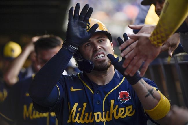 Milwaukee Brewers' Victor Caratini celebrates his fifth-inning home run against the Chicago Cubs in the second game of a baseball doubleheader, Monday, May 30, 2022, at Wrigley Field in Chicago. (AP Photo/Mark Black)