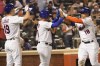 New York Mets' Nick Plummer (18), Mark Canha (19) and Eduardo Escobar celebrate after scoring off Plummers' three-run home run during the fourth inning of a baseball game against the Washington Nationals, Monday, May 30, 2022, in New York. (AP Photo/Mary Altaffer)