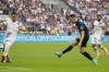 Inter Milan's Ivan Perisic, right, scores his side's opening goal during a Serie A soccer match between Inter Milan and Sampdoria at the San Siro stadium in Milan, Italy, Sunday, May 22, 2022. (AP Photo/Luca Bruno)