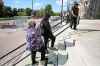 RUTH BONNEVILLE / WINNIPEG FREE PRESS

Clarice Smith (centre), mother of three-year-old Hunter Smith-Straight, stops briefly before  heading into the entrance to the Woodsworth building with her parents to testify about her son's death.