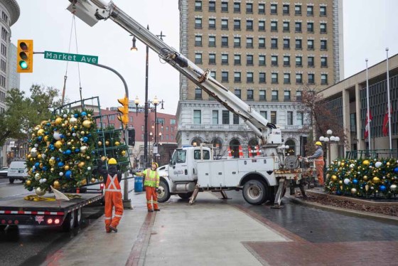 Workers put up a Christmas tree at city hall late last month. (Jessica Lee / Winnipeg Free Press files)