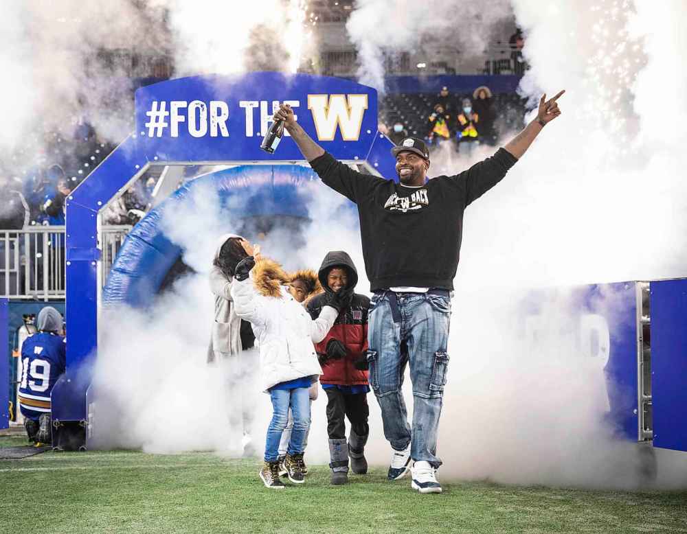 JESSICA LEE / WINNIPEG FREE PRESS
Bombers offensive lineman Jermarcus Hardrick celebrates the recent Grey Cup victory with his family at IG Field Wednesday.