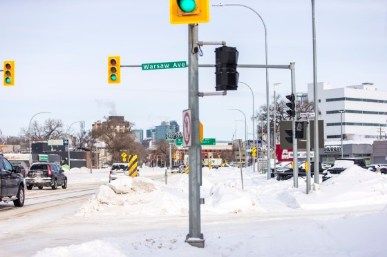 In 2016, work crews installed a traffic pole in the path of a bike lane that was scheduled to go in months later as part of the same project. (Mikaela MacKenzie / Winnipeg Free Press)
