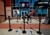 A person walks toward the Philadelphia Phillies team store at Citizens Bank Park on Monday, July 27, 2020, in Philadelphia. The Phillies' game against the New York Yankees on Monday was postponed after several members of the Miami Marlins tested positive for the coronavirus. (Yong Kim/The Philadelphia Inquirer via AP)
