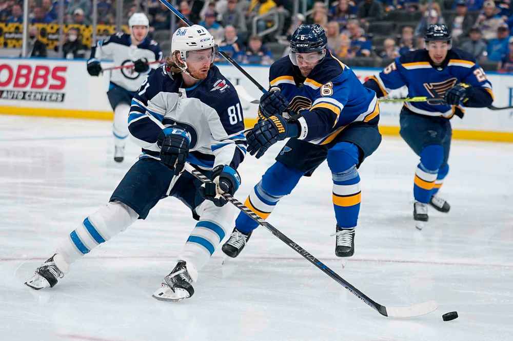 CP
Winnipeg Jets' Kyle Connor handles the puck as St. Louis Blues' Marco Scandella defends during the first period. (Jeff Roberson / The Associated Press)