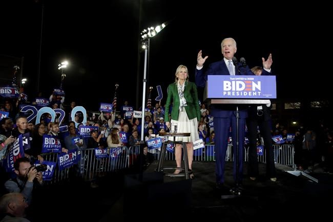 Democratic presidential candidate former Vice President Joe Biden, right, speaks next to his wife Jill during a primary election night rally Tuesday, March 3, 2020, in Los Angeles. (AP Photo/Marcio Jose Sanchez)