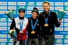 From Left: Martina Sablikova of Czech Republic, second place, Ivanie Blondin of Canada, first place, and Isabelle Weidemann of Canada third place stand on the podium after the ladies 5000 meters race of the speed skating World Cup at the Alau Ice Palace in Nur-Sultan, Kazakhstan, Friday, Dec. 6, 2019. (AP Photo/Stas Filippov)