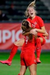 Canada forward Jordyn Huitema, bottom, celebrates her goal with forward Janine Beckie during the second half of a CONACAF women's Olympic qualifying soccer match against Costa Rica on Friday, Feb. 7, 2020, in Carson, Calif. (AP Photo/Chris Carlson)