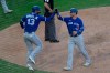 Toronto Blue Jays' Lourdes Gurriel Jr., left, celebrates with Joe Panik after scoring on a Jonathan Davies RBI-double in the sixth inning of a baseball game, Sunday, Sept. 20, 2020, in Philadelphia. Buoyed by a victory over Philadelphia that ended a six-game losing skid, the Blue Jays will look to finish strong over the final week with series against New York and Baltimore. THE CANADIAN PRESS/AP/Michael Perez
