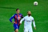 Real Madrid's Sergio Ramos duels for the ball with Eibar's Kike Garcia, right, during the Spanish La Liga soccer match between Eibar and Real Madrid, at Ipurua stadium, in Eibar, northern Spain, Sunday, Dec. 20, 2020. (AP Photo/Alvaro Barrientos)