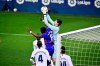 Real Madrid's goalkeeper Thibaut Courtois, controls the ball in front Eibar's Pape Diop during the Spanish La Liga soccer match between Eibar and Real Madrid, at Ipurua stadium, in Eibar, northern Spain, Sunday, Dec. 20, 2020. (AP Photo/Alvaro Barrientos)