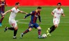 Sevilla's Rakitic and Suso and Barcelona's Messi fight for the ball during a Spanish La Liga soccer match between Sevilla and Barcelona at the Ramon Sanchez-Pizjuan stadium in Seville, Spain, Saturday Feb. 27, 2021. (AP Photo/Angel Fernandez)