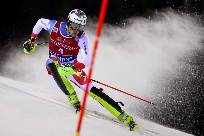 Switzerland's Daniel Yule competes during an alpine ski, men's World Cup slalom in Madonna di Campiglio, Italy, Wednesday, Jan. 8, 2020.(AP Photo/Alessandro Trovati)