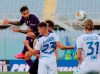 Fiorentina's Federico Ceccherini, left, jumps for the ball for the ball during the Serie A soccer match between Fiorentina and Brescia at the Artemio Franchi Stadium in Florence, Italy, Monday, June 22, 2020. (Marco Bucco/LaPresse via AP)