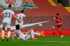 Liverpool's Mohamed Salah, right, scores his side's third goal during the English Premier League soccer match between Liverpool and Leeds United, at the Anfield stadium, in Liverpool, Saturday, Sept. 12, 2020. (Paul Ellis, Pool via AP)