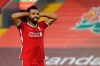Liverpool's Mohamed Salah celebrates after he scored his side's fourth goal during the English Premier League soccer match between Liverpool and Leeds United, at the Anfield stadium, in Liverpool, Saturday, Sept. 12, 2020. (Shaun Botterill, Pool via AP)
