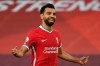 Liverpool's Mohamed Salah celebrates after he scored his side's fourth goal during the English Premier League soccer match between Liverpool and Leeds United, at the Anfield stadium, in Liverpool, Saturday, Sept. 12, 2020. (Shaun Botterill, Pool via AP)