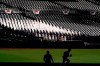Sunlight reflects off fan cutouts in the seats at Petco Park before Game 3 of a baseball American League Championship Series between the Houston Astros and the Tampa Bay Rays, Tuesday, Oct. 13, 2020, in San Diego. (AP Photo/Jae C. Hong)