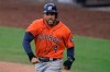 Houston Astros George Springer reacts after scoring on a single by Jose Altuve against the Tampa Bay Rays during the fifth inning in Game 6 of a baseball American League Championship Series, Friday, Oct. 16, 2020, in San Diego. (AP Photo/Gregory Bull)