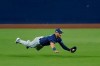 Tampa Bay Rays center fielder Kevin Kiermaier makes a leaping catch on a fly ball by Houston Astros Carlos Correa during the third inning in Game 3 of a baseball American League Championship Series, Tuesday, Oct. 13, 2020, in San Diego. (AP Photo/Ashley Landis)