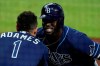 Tampa Bay Rays Randy Arozarena celebrates his two run home run with Rays' Willy Adames during the fourth inning against the Houston Astros in Game 4 of a baseball American League Championship Series, Wednesday, Oct. 14, 2020, in San Diego.(AP Photo/Ashley Landis)