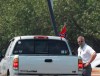 A race fan flying a Confederate battle flag passes through a checkpoint as he enters Talladega Superspeedway for a NASCAR Cup Series auto race in Talladega, Ala., Sunday, June 21, 2020. (AP Photo/John Bazemore)