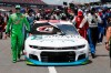 Nascar drivers Kyle Busch, left, and Corey LaJoie, right, join other drivers and crews as they push the car of Bubba Wallace to the front of the field prior to the start of the NASCAR Cup Series auto race at the Talladega Superspeedway in Talladega Ala., Monday June 22, 2020. In an extraordinary act of solidarity with NASCAR’s only Black driver, dozens of drivers pushed the car belonging to Bubba Wallace to the front of the field before Monday’s race as FBI agents nearby tried to find out who left a noose in his garage stall over the weekend. (AP Photo/John Bazemore)