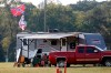 A camper displays Confederate Battle flag in a campground across from the Speedway during the NASCAR Xfinity auto race at the Talladega Superspeedway in Talladega Ala., Saturday June 20, 2020 (AP Photo/John Bazemore)