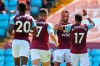 Aston Villa's Trezeguet, right, celebrates after scoring his side's first goal during the English Premier League soccer match between Aston Villa and Crystal Palace at Villa Park in Birmingham, England, Sunday, July 12, 2020. (Catherine Ivill/Pool Photo via AP)