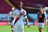 Crystal Palace's Wilfried Zaha reacts during the English Premier League soccer match between Aston Villa and Crystal Palace at Villa Park in Birmingham, England, Sunday, July 12, 2020. (AP Photo/Rui Viera, Pool)