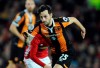 FILE - In this Tuesday, Jan. 10, 2017 file photo, Hull City's Ryan Mason runs, during the English League Cup semifinal, 1st leg, soccer match between Manchester United and Hull at Old Trafford stadium in Manchester, England. Mason will lead Tottenham into the English League Cup final against Manchester City on Sunday, April 25, 2021 as the youngest manager in the club’s history after being installed as replacement for the fired Jose Mourinho until the end of the season. The 29-year-old Mason retired from playing in 2018 on medical advice after failing to fully recover from a fractured skull following a clash of heads during a Premier League game. (AP Photo/Rui Vieira, File)