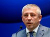 FILE - In this Friday, March 31, 2017 file photo, President of Serbia's Football Association Slavisa Kokeza speaks during a news conference in Stara Pazova, near Belgrade, Serbia. Police have taken in the president of the Serbian Football Association for questioning in connection to recent arrests of several members of soccer fan groups accused of murder, kidnapping and drug trafficking. Serbian media said Sunday, Feb. 28, 2021, Slavisa Kokeza will be quizzed over his links to Partizan Belgrade supporter group leaders who were detained earlier this month in what officials say is a major crackdown against organized crime.(AP Photo/Darko Vojinovic, File)