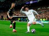 FILE - In this Wednesday, Feb. 26, 2020 file photo, Real Madrid's Isco, right, duels for the ball with Manchester City's Kyle Walker during the Champions League, round of 16, first leg soccer match between Real Madrid and Manchester City at the Santiago Bernabeu stadium in Madrid, Spain. Manchester City’s appeal against a two-year ban from European soccer will be heard over three days in June. The Court of Arbitration for Sport says it has set aside June 8-10 for the case. It is unclear if a hearing will be held in person at the court or by video link. No timetable was set for a verdict but a ruling is needed before English teams enter next season’s Champions League draw. Man City was banned by UEFA in February for “serious breaches” of financial monitoring rules and failing to cooperate with investigators. (AP Photo/Manu Fernandez, File)