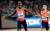 FILE - In this Sunday, Aug. 13, 2017 file photo, Kenya's Elijah Manangoi celebrates winning the gold medal in the Men's 1500m final during the World Athletics Championships in London. Former 1,500-meter world champion Elijah Manangoi was provisionally suspended Thursday, July 23, 2020 for missing doping tests. The Athletics Integrity Unit said the Kenyan runner has been charged with ‚Äúwhereabouts failures.‚Äù No timetable for his disciplinary case was given. (AP Photo/David J. Phillip, File)
