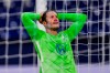 FILE - In this Saturday, Nov. 21, 2020 file photo, Wolfsburg's Wout Weghorst reacts during the German Bundesliga soccer match between VfL Wolfsburg and FC Schalke 04 at the Veltins-Arena in Gelsenkirchen, Germany. Dutch striker Wout Weghorst has apologized for appearing to make light of the coronavirus in a social media post on Monday, Dec. 14, 2020. Weghorst was trending on Twitter in Germany due to his Instagram story in which he appeared to endorse a message saying, “Imagine a vaccine so safe you have to be threaten to take it -- for a disease so deadly you have to be tested to know you have it.” (AP Photo/Martin Meissner, Pool, File)