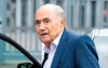 FILE - In this Tuesday, Sept. 1, 2020 file photo, former FIFA President Sepp Blatter, center, appears in front of the building of the Office of the Attorney General of Switzerland, in Bern, Switzerland. Former FIFA president Blatter spent a week in an induced coma after having heart surgery in December, his family said on Thursday, Jan. 21, 2021. The 84-year-old Blatter, who also tested positive for COVID-19 late last year, was well enough only this week to be moved from an intensive care unit at the hospital. (Peter Schneider/Keystone via AP, FIle)
