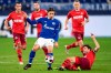 Schalke's Benjamin Stambouli, left and Cologne's Jonas Hector fight for the ball, during the German Bundesliga soccer match between Schalke and Cologne, at Veltins-Arena, in Gelsenkirchen, Germany, Wednesday, Jan. 20, 2021. (Marius Becker/dpa via AP)