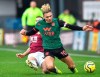 Burnley's Phil Bardsley, background tackles Aston Villa's Jack Grealish, during the English Premier League soccer match between Burnley and Aston Villa, at Turf Moor, Burnley, England, Wednesday Jan. 1, 2020. (Anthony Devlin/PA via AP)