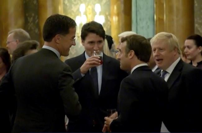 In this grab taken from video on Tuesday, Dec. 3, 2019, Britain's Prime Minister Boris Johnson, right, speaks during a NATO reception. While NATO leaders are professing unity as they gather for a summit near London, several seem to have been caught in an unguarded exchange on camera apparently gossiping about U.S. President Donald Trump’s behavior. In footage recorded during a reception at Buckingham Palace on Tuesday, Canadian Prime Minister Justin Trudeau was seen standing in a huddle with French President Emmanuel Macron, British Prime Minister Boris Johnson, Dutch Prime Minister Mark Rutte and Britain’s Princess Anne. (Host Broadcaster via AP)