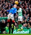 Rangers' Ryan Kent, left and Celtic's Jeremie Frimpong battle for a header, during the Scottish Premiership soccer match between Celtic and Rangers at Celtic Park, in Glasgow, Scotland, Sunday Dec. 29, 2019. The Scottish title race opened up further when Nikola Katic's header gave Rangers a 2-1 victory over leader Celtic in the derby between the Glasgow rivals. (Andrew Milligan/PA via AP)