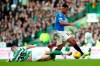 Celtic's Kristoffer Ajer, left and Rangers' Alfredo Morelos battle for the ball, during the Scottish Premiership soccer match between Celtic and Rangers at Celtic Park, in Glasgow, Scotland, Sunday Dec. 29, 2019. The Scottish title race opened up further when Nikola Katic's header gave Rangers a 2-1 victory over leader Celtic in the derby between the Glasgow rivals. (Andrew Milligan/PA via AP)