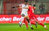 FSV Mainz's Jean-Philippe Mateta, left, vies for the ball with Berlin's Grischa Promel during the German Bundesliga soccer match between FC Union Berlin and FSV Mainz, at the Stadion An der Alten Forsterei, in Berlin, Friday, Oct. 2, 2020. (Andreas Gora/dpa via AP)