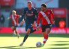 Arsenal's Rob Holding, left and Southampton's Che Adams battle for the ball during the FA Cup fourth round soccer match between Southampton and Arsenal, at St. Mary's Stadium, in Southampton, England, Saturday Jan. 23, 2021. (Catherine Ivill/PA via AP)
