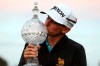 USA's John Catlin celebrates with the trophy after winning The Irish Open at Galgorm Castle Golf Club, in Ballymena, Northern Ireland, Sunday, Sept. 27, 2020. (Brian Lawless/PA via AP)